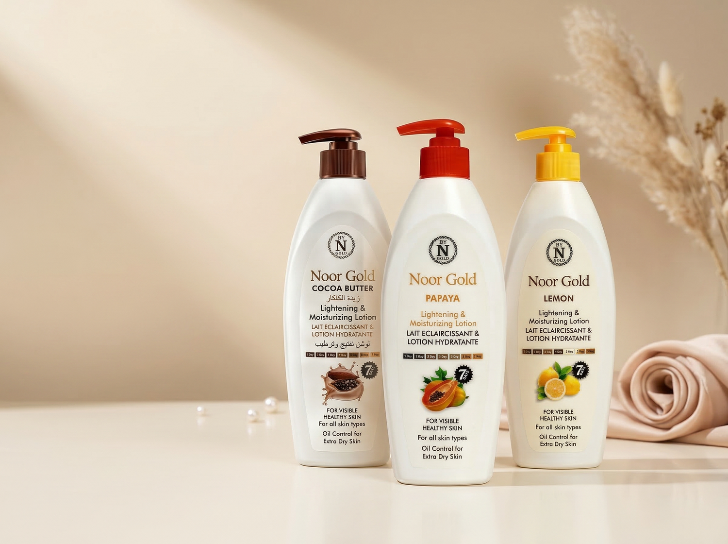 Noor Gold lightening and moisturizing body lotion collection featuring cocoa butter, papaya, and lemon variants displayed on a soft neutral background.