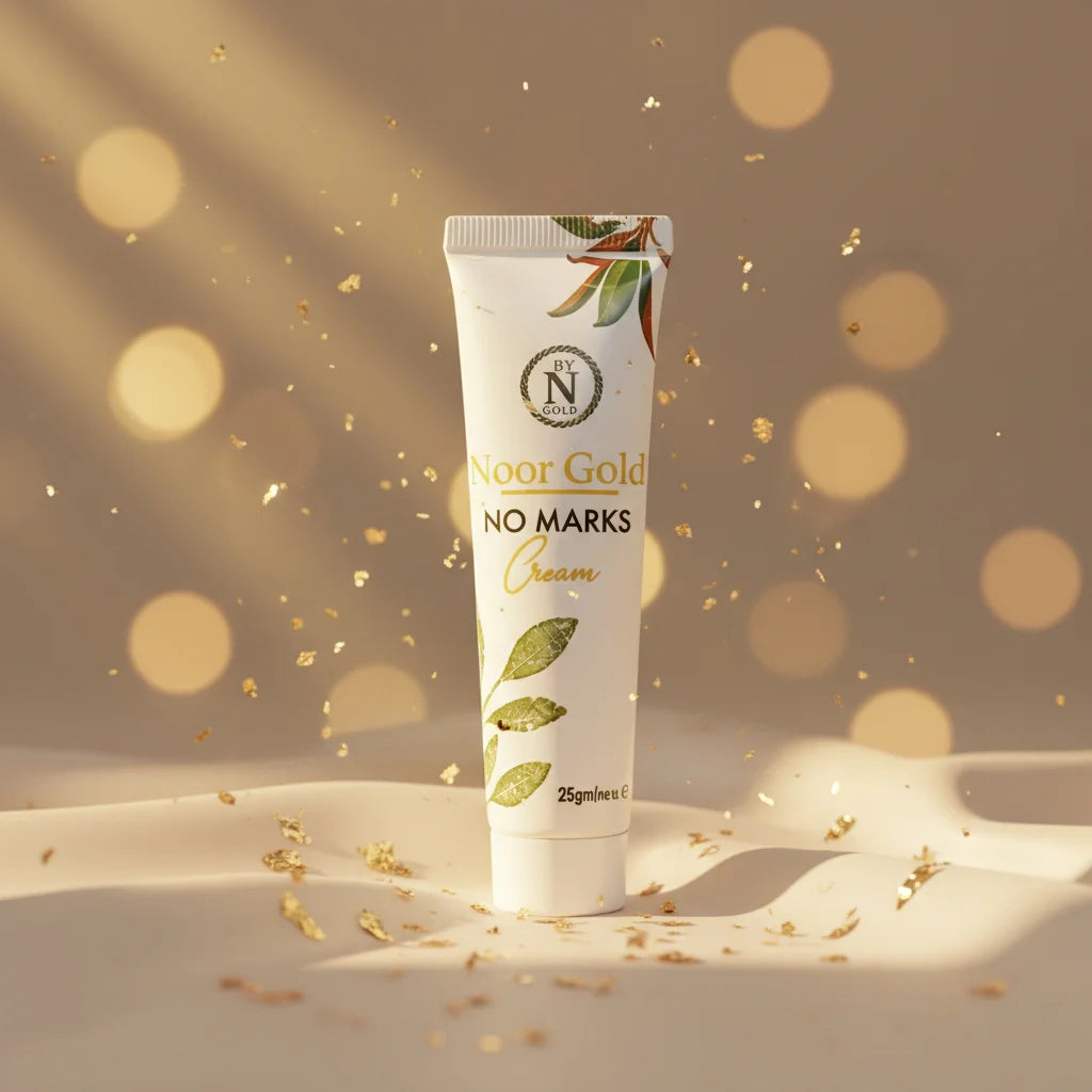 Tube of 'Noor Gold No Marks Cream' on a beige background with gold accents